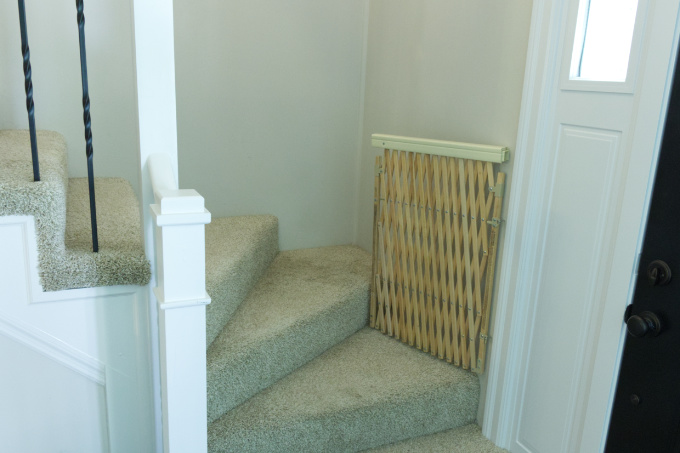 Baby gate hung on stairs for safety