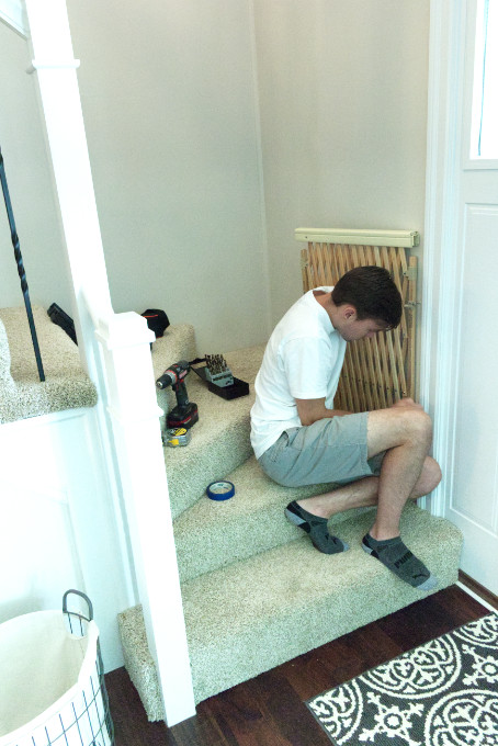Hanging accordion baby gate on screw eyes