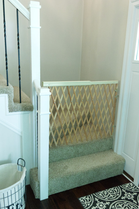 Baby gate hung on stairs for safety