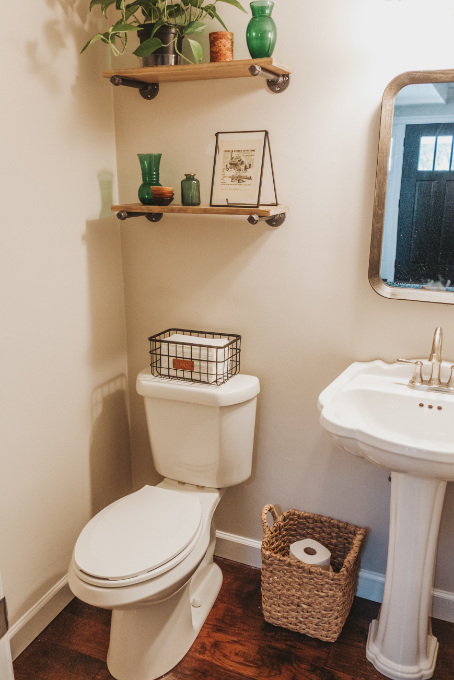 Half bathroom makeover shelving vintage industrial farmhouse decor plants modern vintage print on industrial shelf black wood mirror