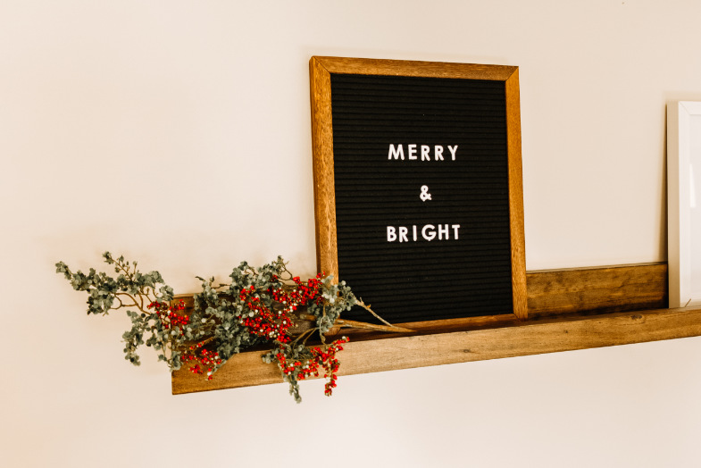DIY picture frame ledge shelf decorated on wall above couch