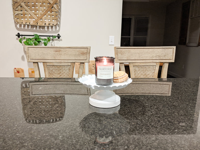 Cushioned bar stool pair behind kitchen island countertop