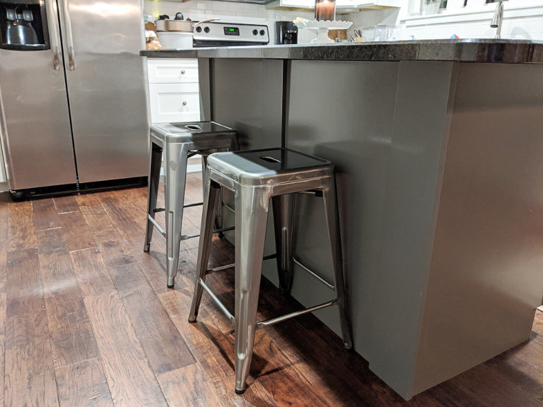 Metal stools at kitchen island
